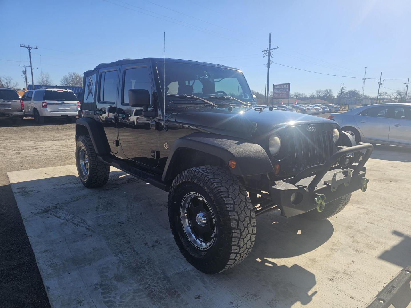 2010 BLACK Jeep Wrangler Unlimited Sport 4WD (1J4BA3H16AL) with an 3.8L V6 OHV 12V engine, located at 607 S Seven Points BLVD, Seven Points, TX, 75143, (430) 255-4030, 32.313934, -96.207932 - Photo#1